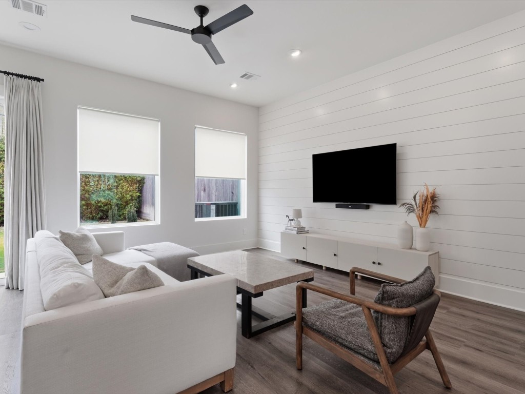4606 Fisk Street, Unit B Houston, TX 77009 - Photo 17 of 38 a living room with furniture and a flat screen tv