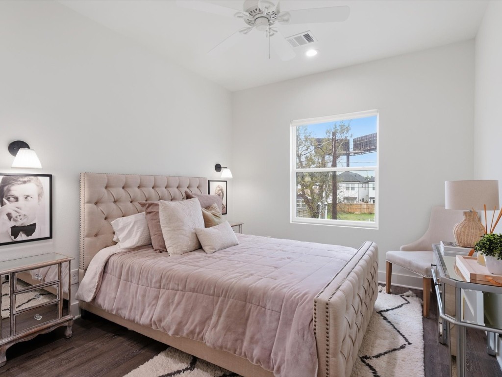 4606 Fisk Street, Unit B Houston, TX 77009 - Photo 27 of 38 a bedroom with a bed and wooden floor
