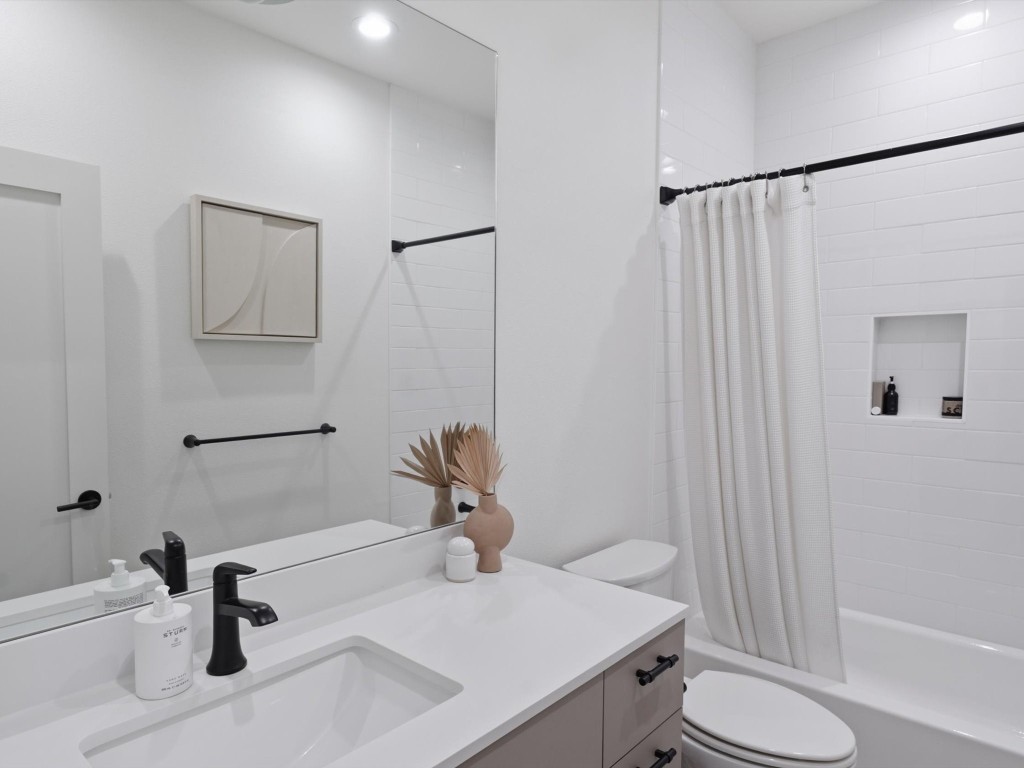 4606 Fisk Street, Unit B Houston, TX 77009 - Photo 30 of 38 a bathroom with a sink toilet and shower