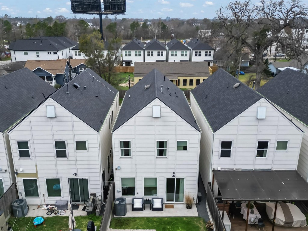 4606 Fisk Street, Unit B Houston, TX 77009 - Photo 36 of 38 a view of a big house with a big yard and large trees