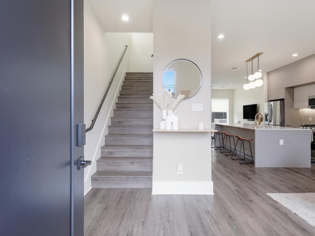 4606 Fisk Street, Unit B Houston, TX 77009 - Photo 9 of 38 a view of kitchen and hall with wooden floor