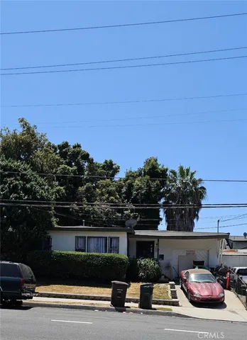 a view of a car parked in front of a building
