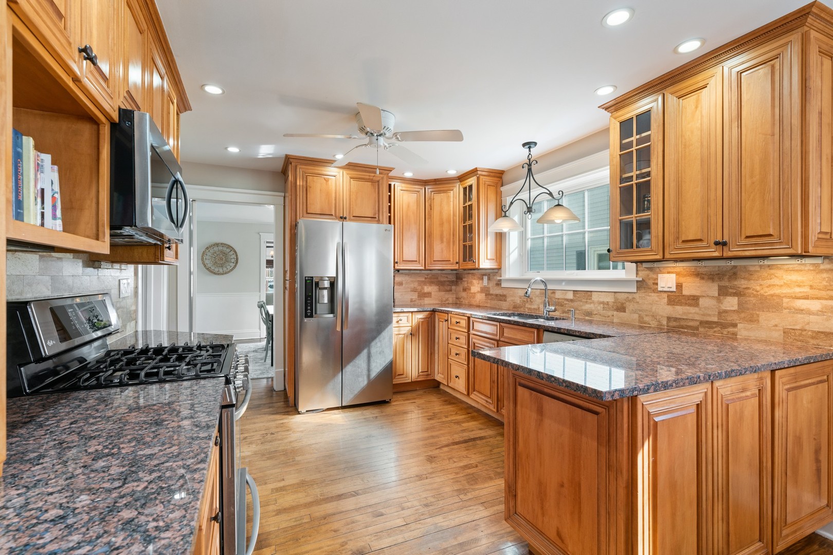 538 Exmoor Road Kenilworth, IL 60043 - Photo 8 of 45 a kitchen with stainless steel appliances granite countertop a refrigerator a stove and a sink