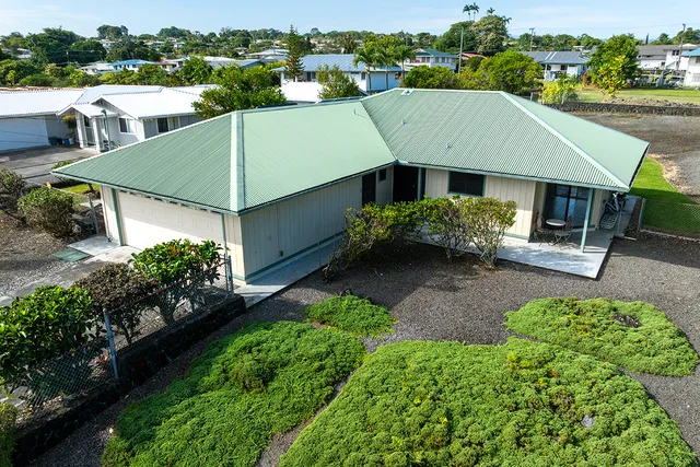 an aerial view of a house with a garden