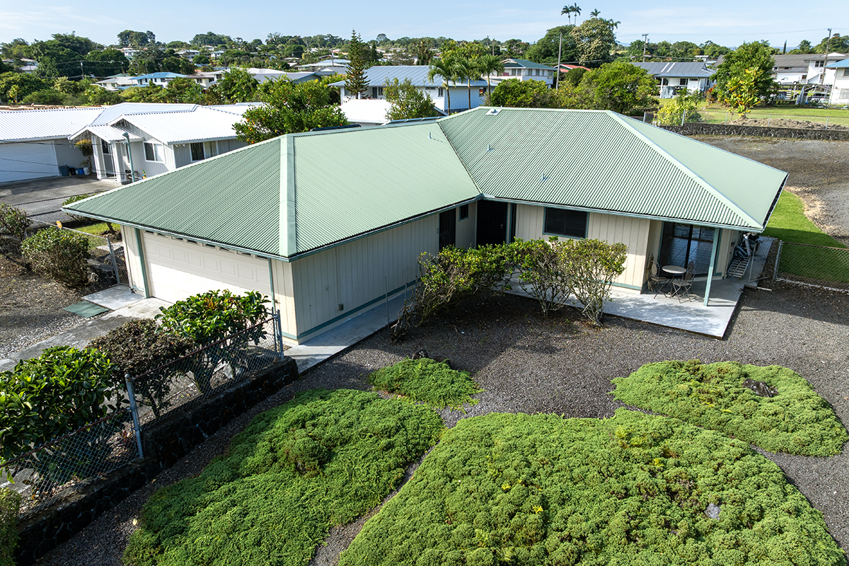 an aerial view of a house with a garden