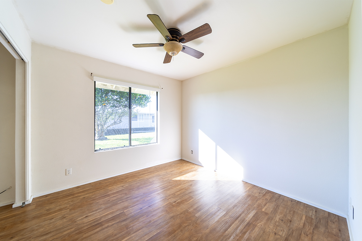 20 Naniakea Street Hilo, HI 96720 - Photo 12 of 29 a view of an empty room with wooden floor and a window