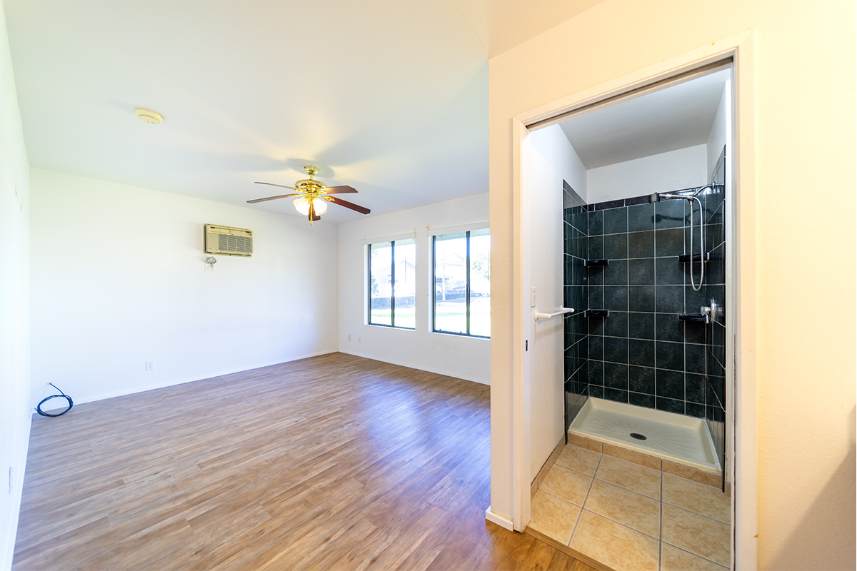 20 Naniakea Street Hilo, HI 96720 - Photo 13 of 29 a view of empty room with wooden floor and fan