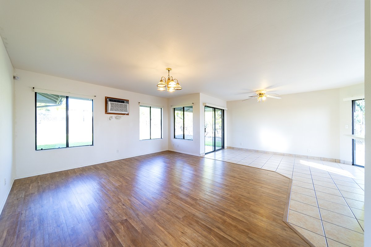 20 Naniakea Street Hilo, HI 96720 - Photo 2 of 29 a view of an empty room with wooden floor and a window