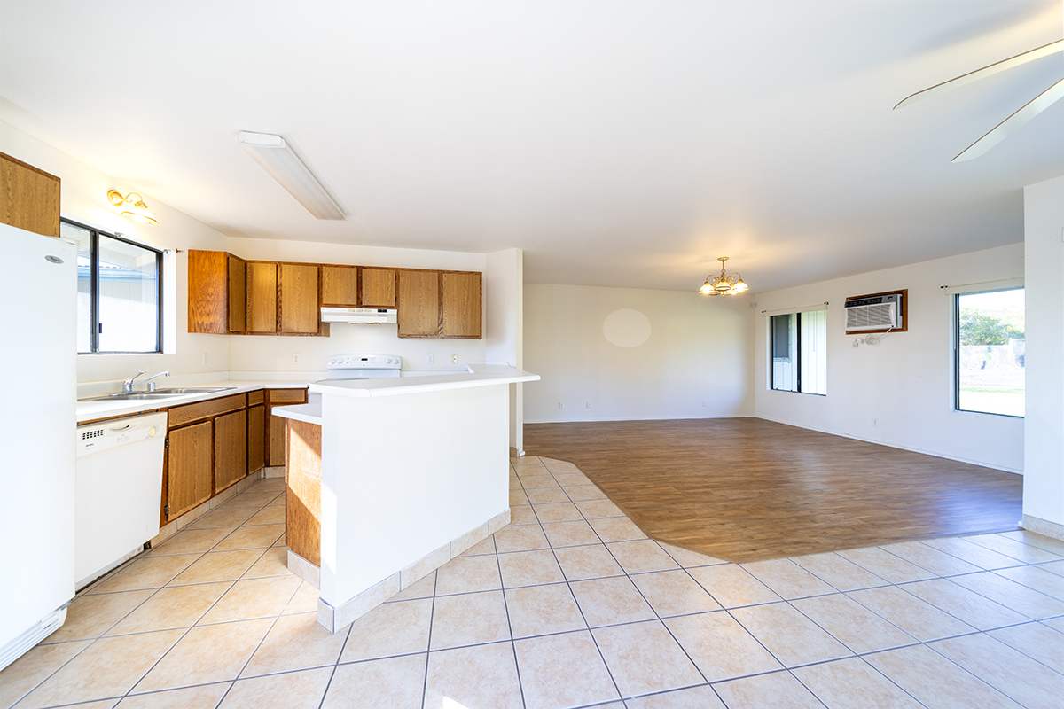 20 Naniakea Street Hilo, HI 96720 - Photo 6 of 29 a view of a kitchen with kitchen island granite countertop a sink and a stove top oven