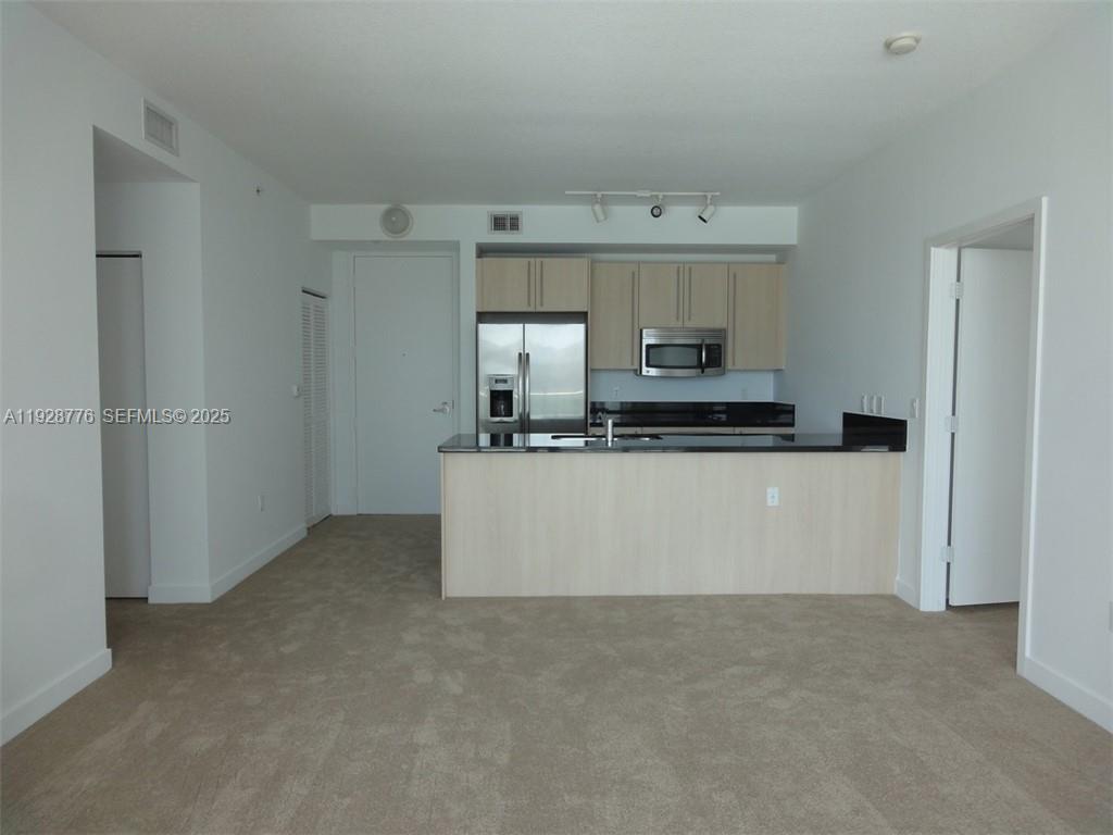79 Southwest 12th Street, Unit 1203S Miami, FL 33130 - Photo 20 of 21 a view of kitchen with an oven