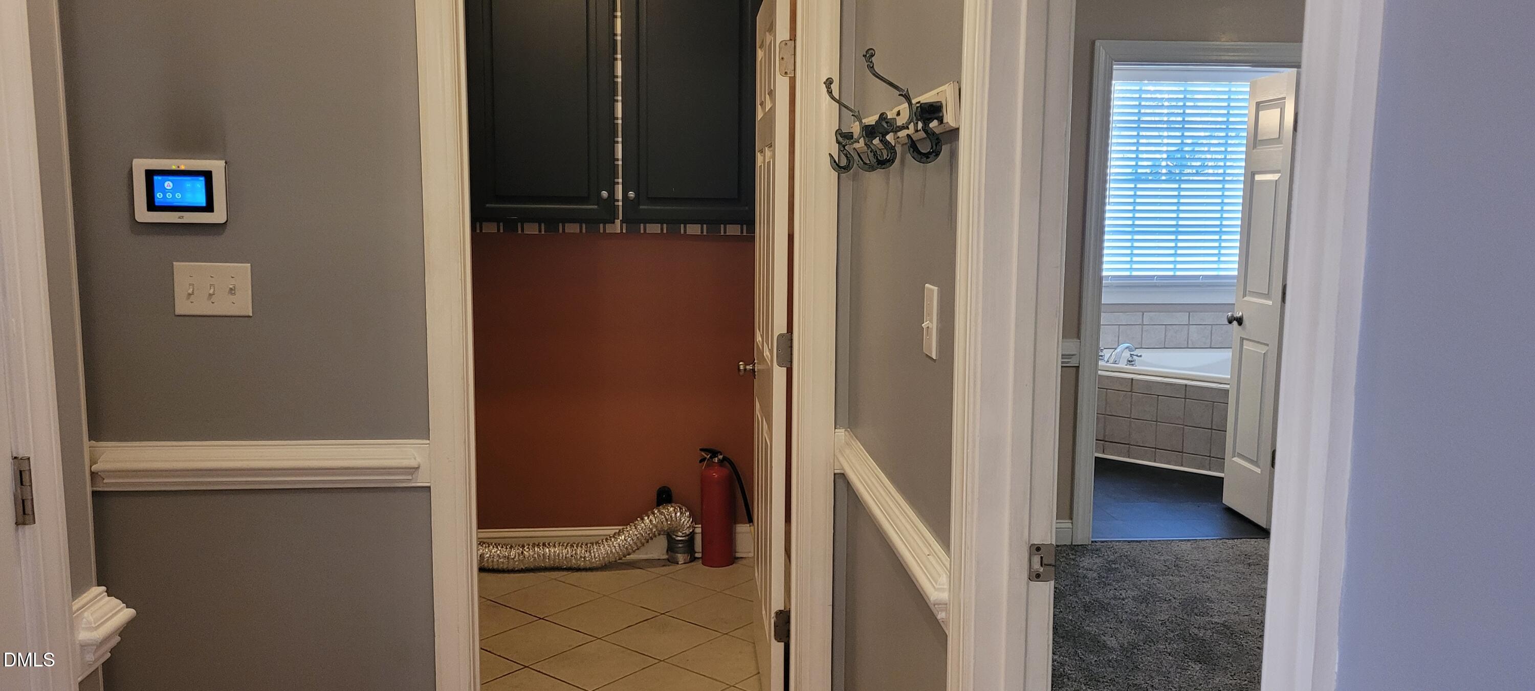 226 Fletcher Ridge Road Timberlake, NC 27583 - Photo 11 of 30 a view of a hallway with toilet and a door