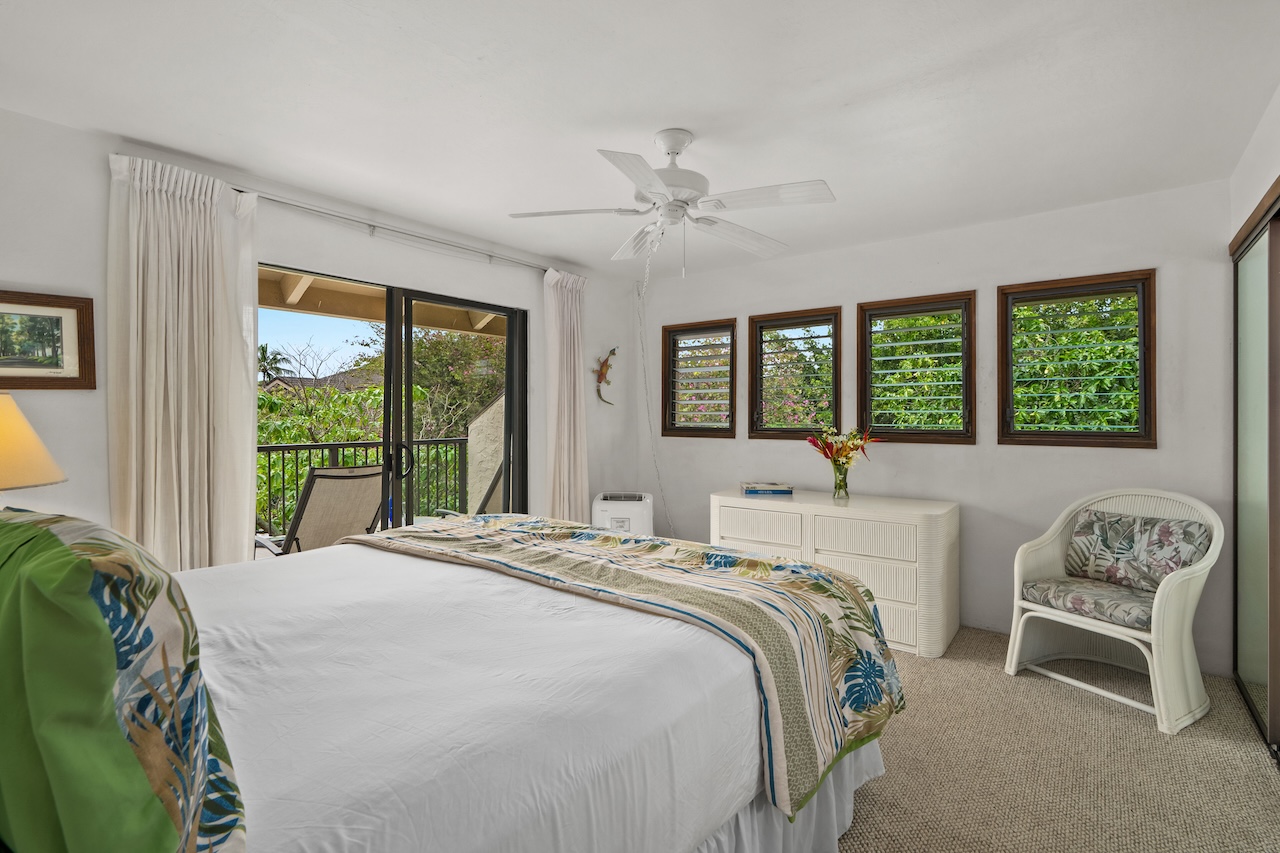 1901 Poipu Road, Unit 421 Koloa, HI 96756 - Photo 16 of 26 a bedroom with a bed and a large window