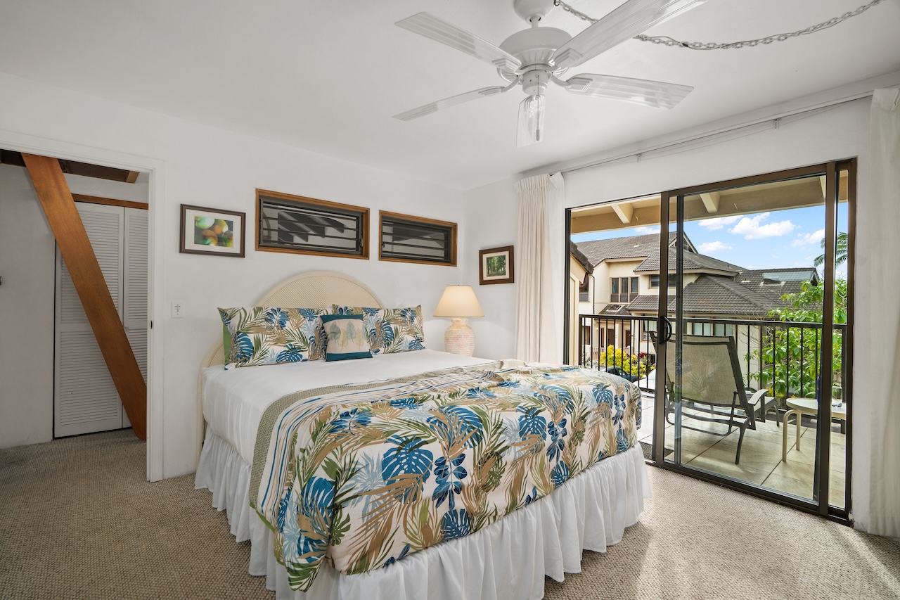 1901 Poipu Road, Unit 421 Koloa, HI 96756 - Photo 17 of 26 a bedroom with a large bed and a large window