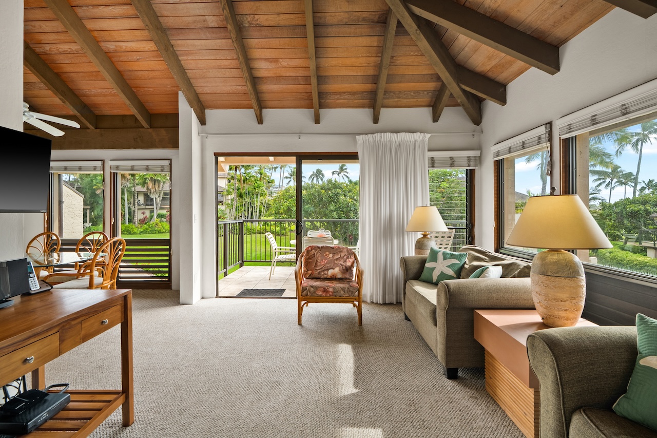 1901 Poipu Road, Unit 421 Koloa, HI 96756 - Photo 4 of 26 a living room with furniture and a flat screen tv