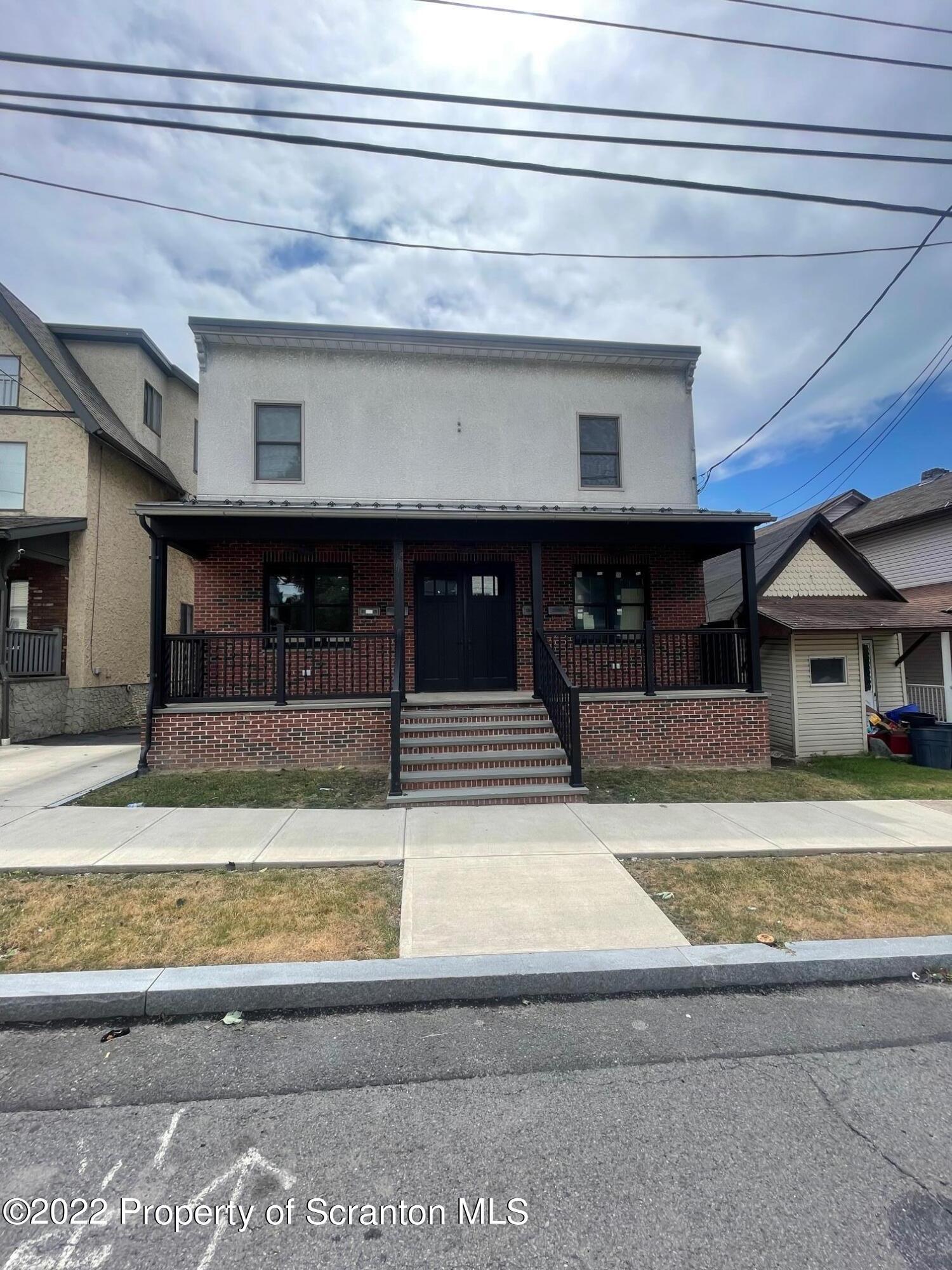 a view of a living room and entryway