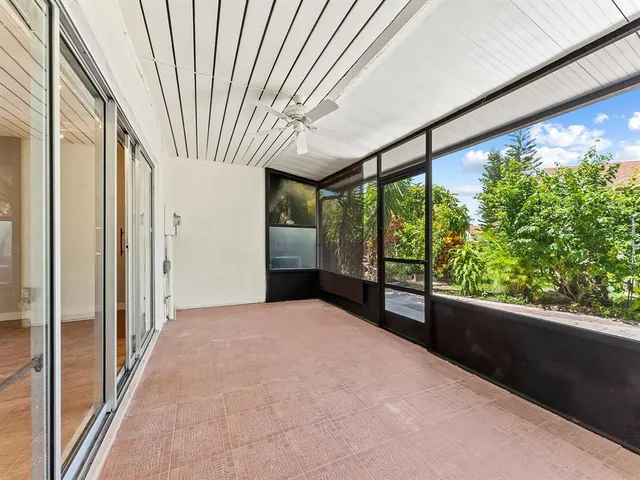 a view of an empty room with a large window