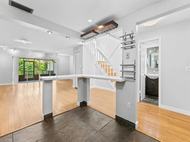 a view of a kitchen with furniture and a kitchen