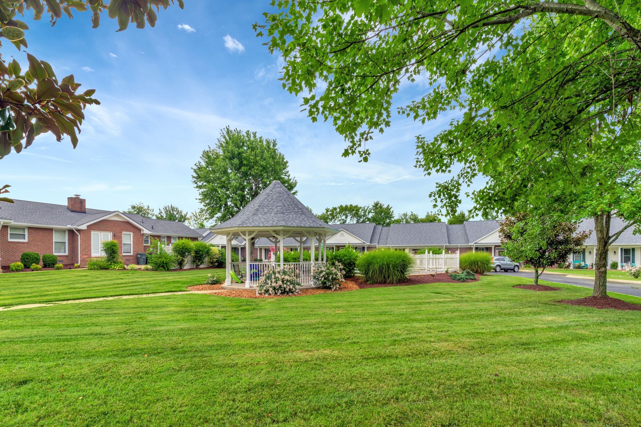 705 Blackpatch Drive, Unit 20 Springfield, TN 37172 - Photo 31 of 41 a view of house in front of a big yard with potted plants and large trees