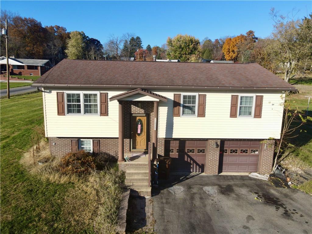 1239 Old State Road Apollo, PA 15613 - Photo 1 of 18 a aerial view of a house with table and chairs
