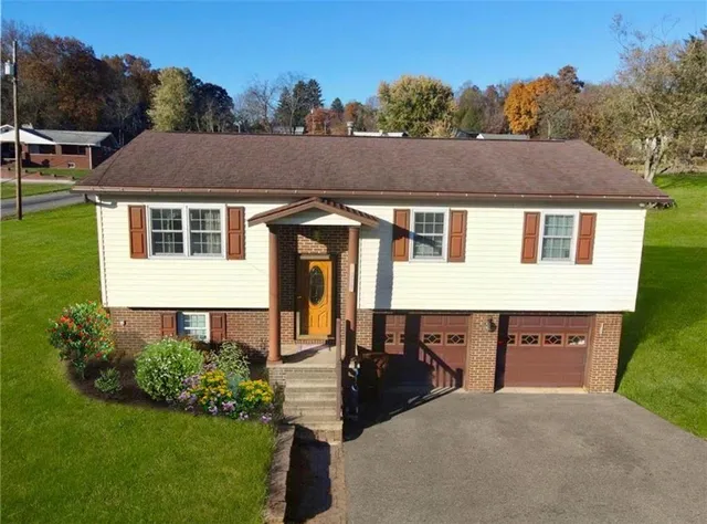 a aerial view of a house yard and mountain view