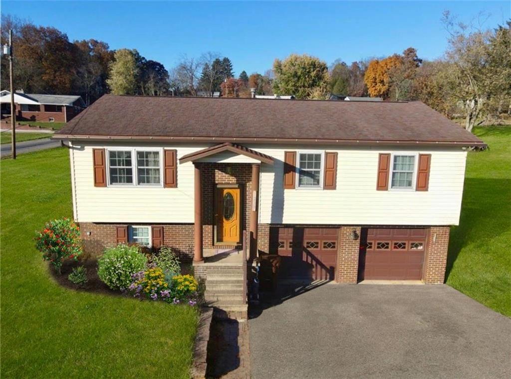 a aerial view of a house yard and mountain view