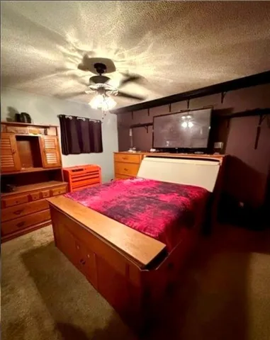 a living room with table chairs and a projector screen