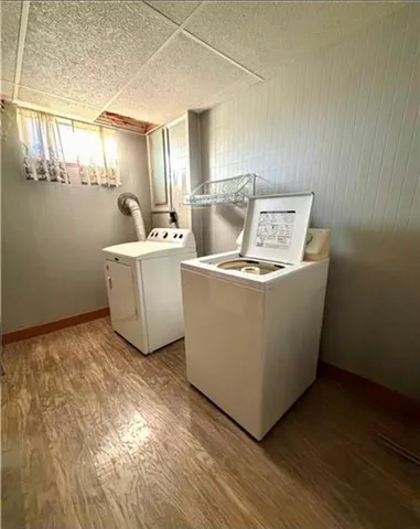 a living room with furniture and floor to ceiling window