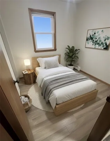 a bedroom with a bed and a painting on the wall