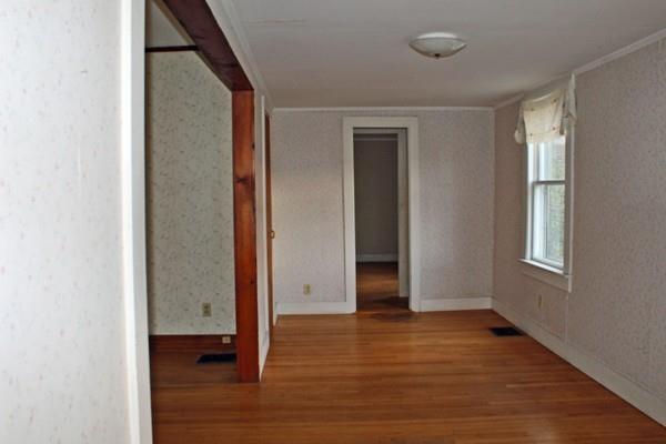 859 Greenfield Road Leyden, MA 01337 - Photo 14 of 42 an empty room with wooden floor and windows