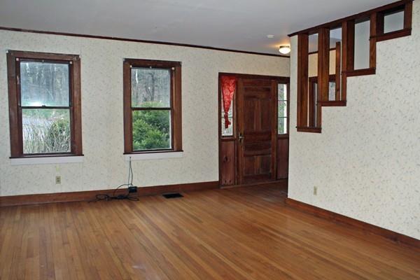 859 Greenfield Road Leyden, MA 01337 - Photo 18 of 42 an empty room with wooden floor and windows