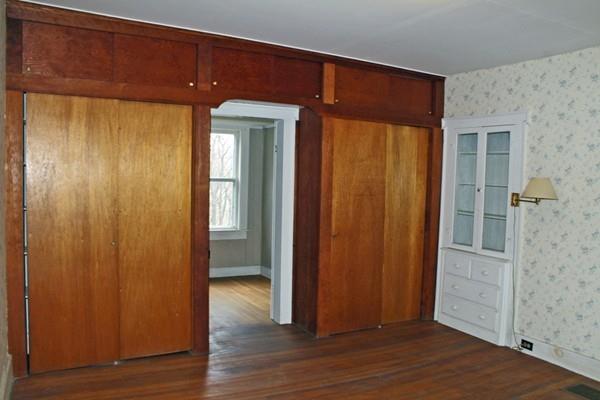 859 Greenfield Road Leyden, MA 01337 - Photo 19 of 42 an empty room with wooden floor and closet