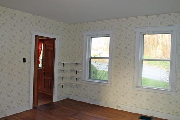 859 Greenfield Road Leyden, MA 01337 - Photo 20 of 42 an empty room with wooden floor and windows