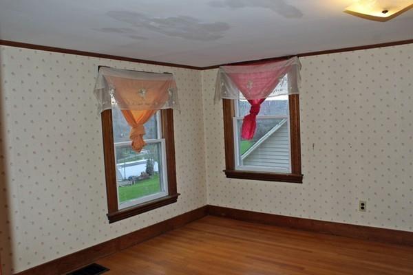 859 Greenfield Road Leyden, MA 01337 - Photo 24 of 42 a view of an empty room with wooden floor and a window