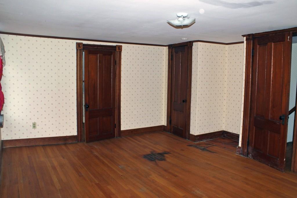 859 Greenfield Road Leyden, MA 01337 - Photo 25 of 42 a view of an empty room with wooden floor and a window