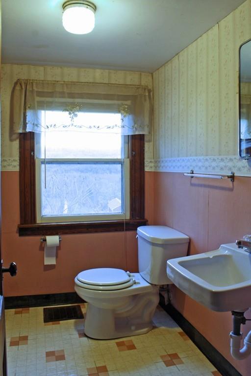 859 Greenfield Road Leyden, MA 01337 - Photo 26 of 42 a bathroom with a toilet a sink and a mirror