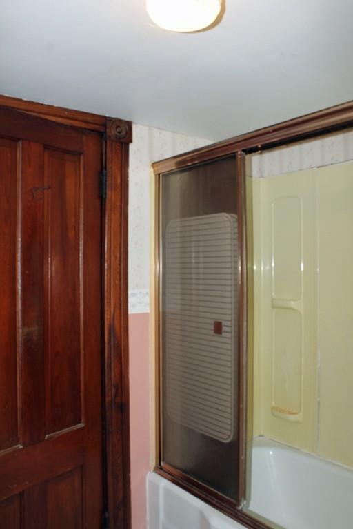 859 Greenfield Road Leyden, MA 01337 - Photo 27 of 42 a bathroom with a shower and a mirror
