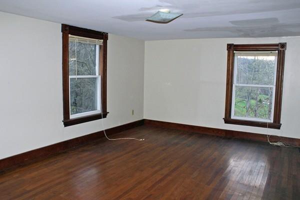 859 Greenfield Road Leyden, MA 01337 - Photo 28 of 42 a view of an empty room with wooden floor and a window