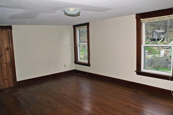 859 Greenfield Road Leyden, MA 01337 - Photo 29 of 42 a view of an empty room with wooden floor and a window
