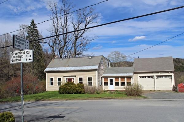 859 Greenfield Road Leyden, MA 01337 - Photo 3 of 42 a front view of a house with a garden