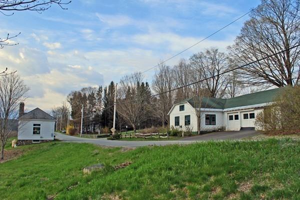 859 Greenfield Road Leyden, MA 01337 - Photo 39 of 42 a view of house with a big yard and large trees