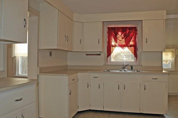 859 Greenfield Road Leyden, MA 01337 - Photo 7 of 42 a room with wooden floor and cabinets