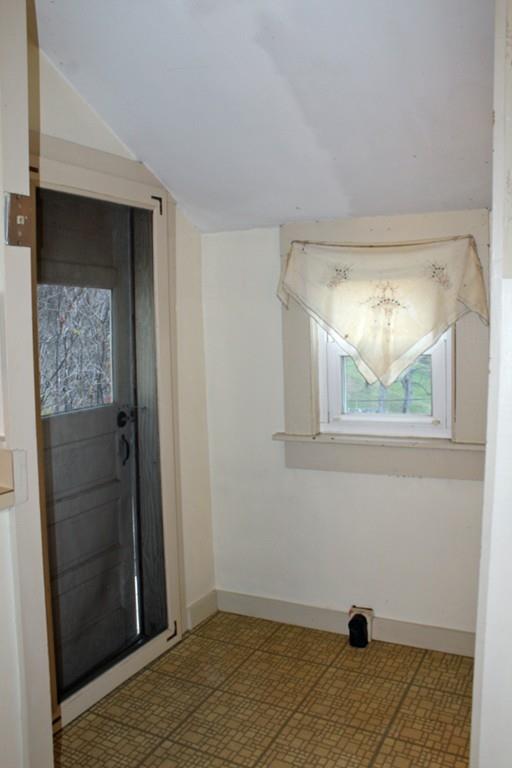 859 Greenfield Road Leyden, MA 01337 - Photo 8 of 42 a view of a hallway with wooden floor and a cabinet