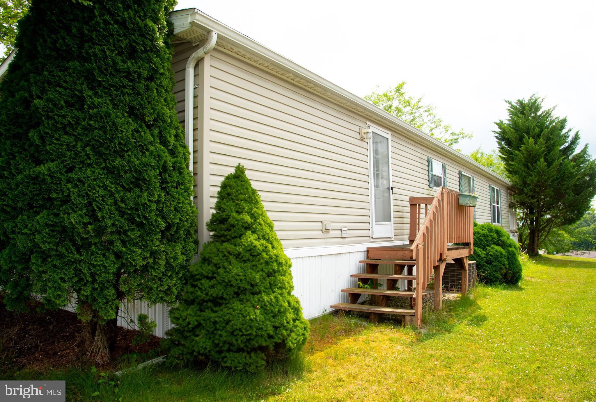 104 Raptor Drive Hanover, PA 17331 - Photo 12 of 30 a backyard of a house with garden and plants