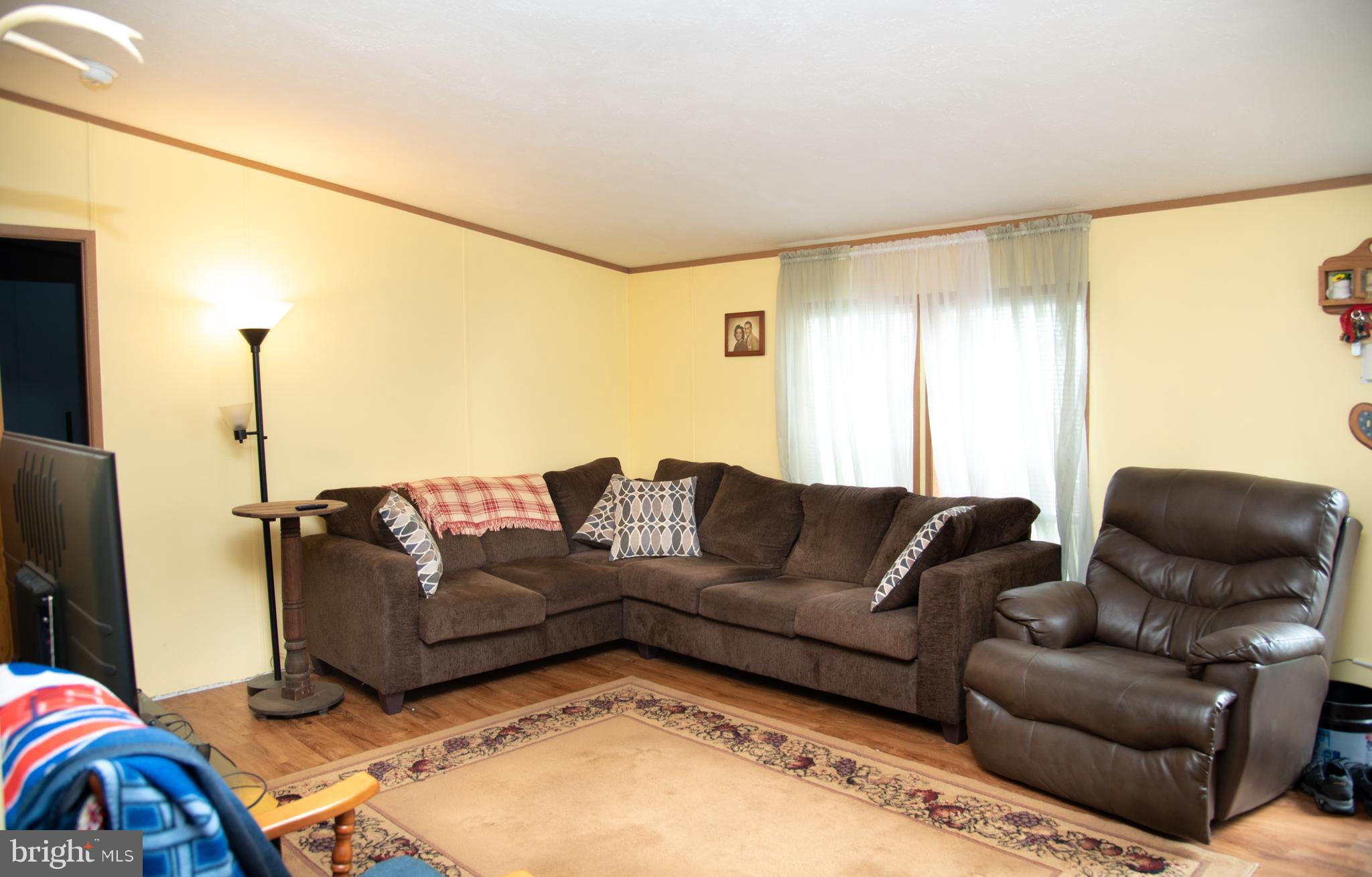 104 Raptor Drive Hanover, PA 17331 - Photo 13 of 30 a living room with furniture and a wooden floor