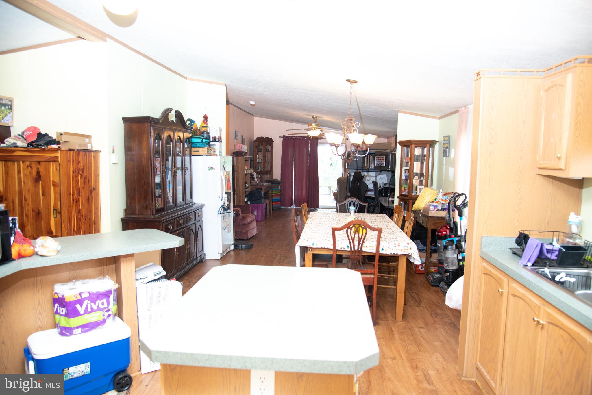 104 Raptor Drive Hanover, PA 17331 - Photo 18 of 30 a view of kitchen island with stainless steel appliances kitchen island granite countertop furniture and a dining table