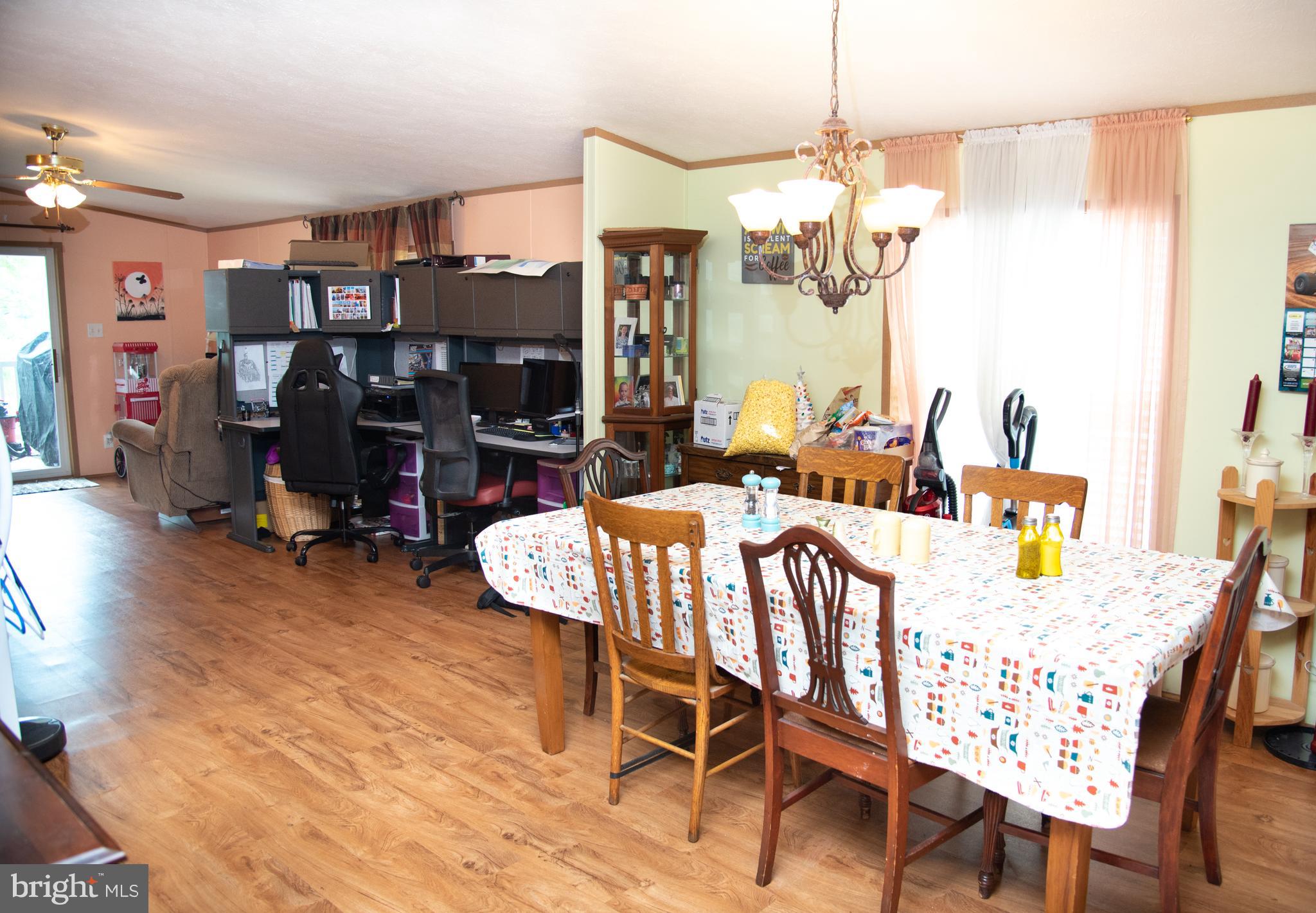 104 Raptor Drive Hanover, PA 17331 - Photo 20 of 30 a view of a dining room with furniture window and wooden floor