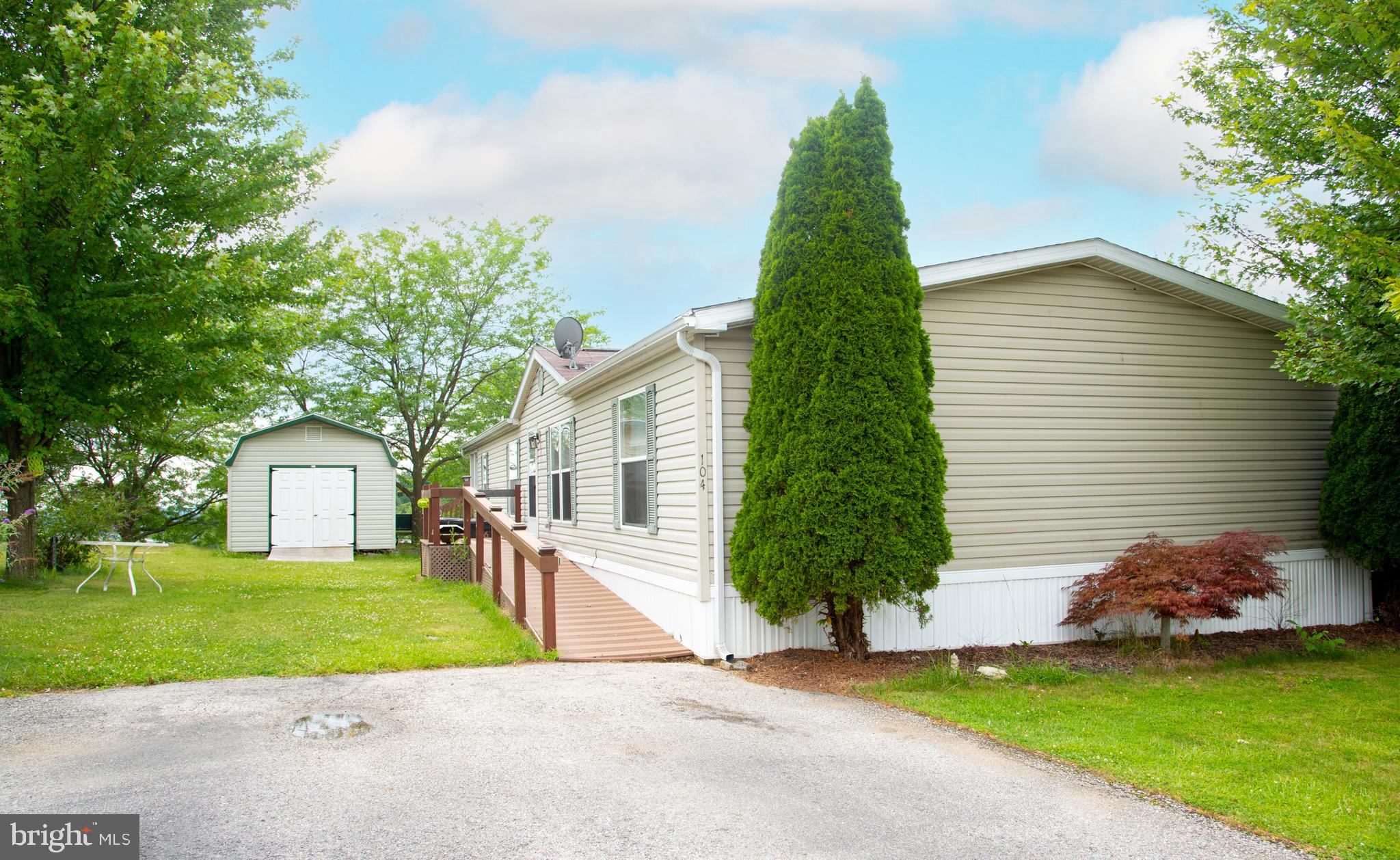 104 Raptor Drive Hanover, PA 17331 - Photo 2 of 30 a front view of a house with a garden and yard