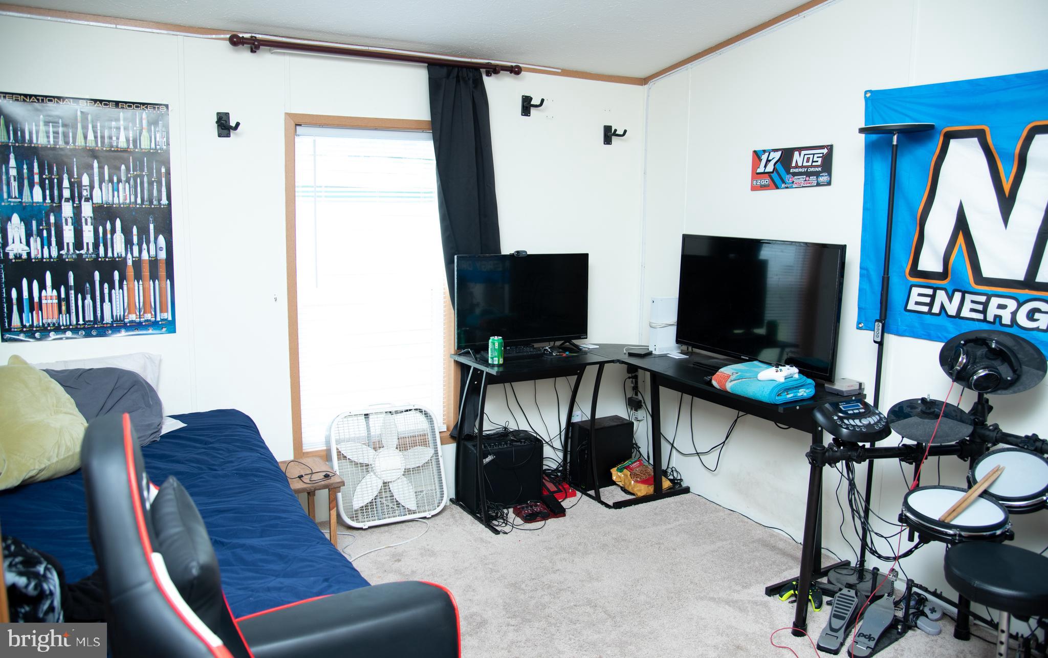 104 Raptor Drive Hanover, PA 17331 - Photo 23 of 30 a living room with furniture and a flat screen tv