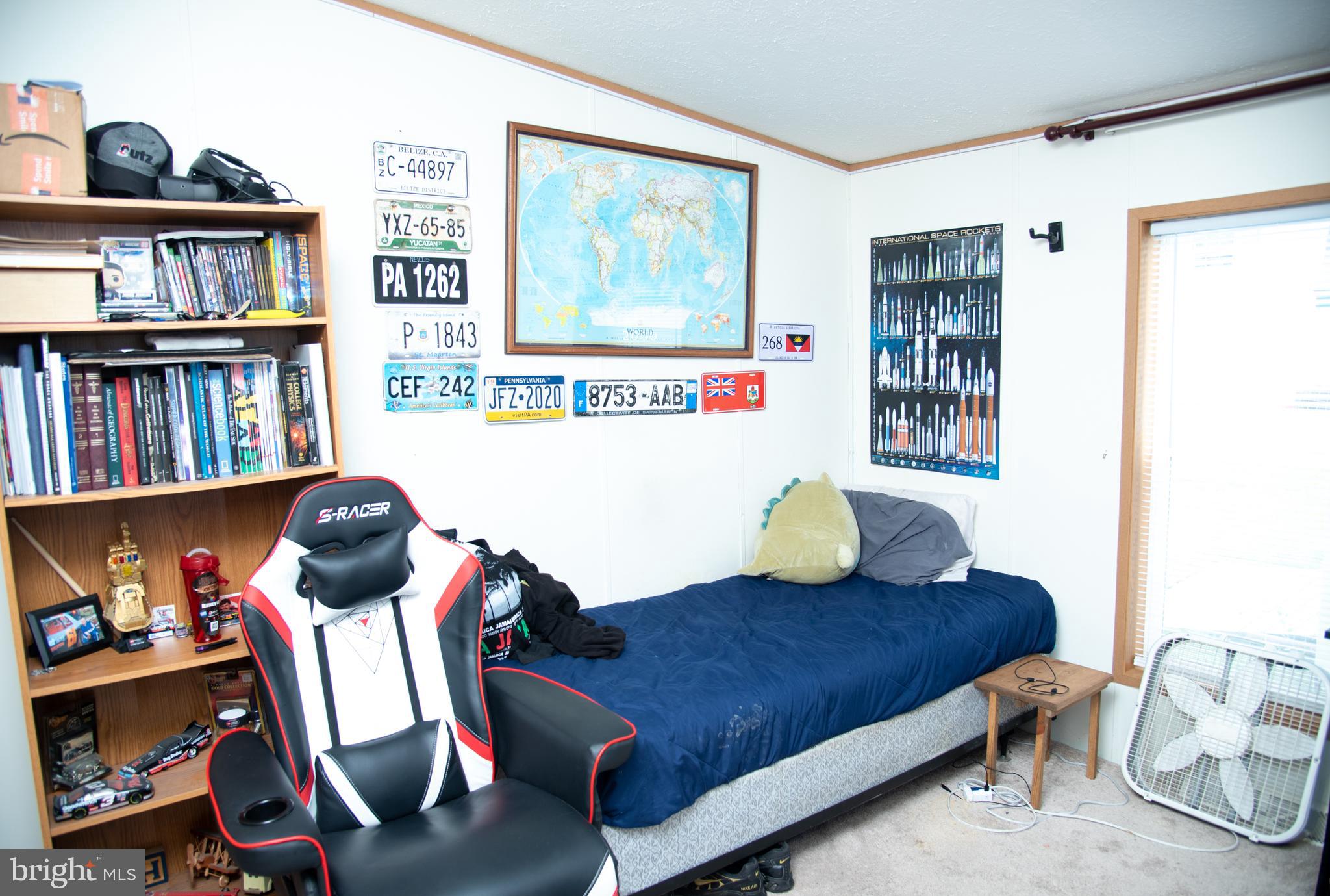 104 Raptor Drive Hanover, PA 17331 - Photo 24 of 30 a living room with furniture and a book shelf
