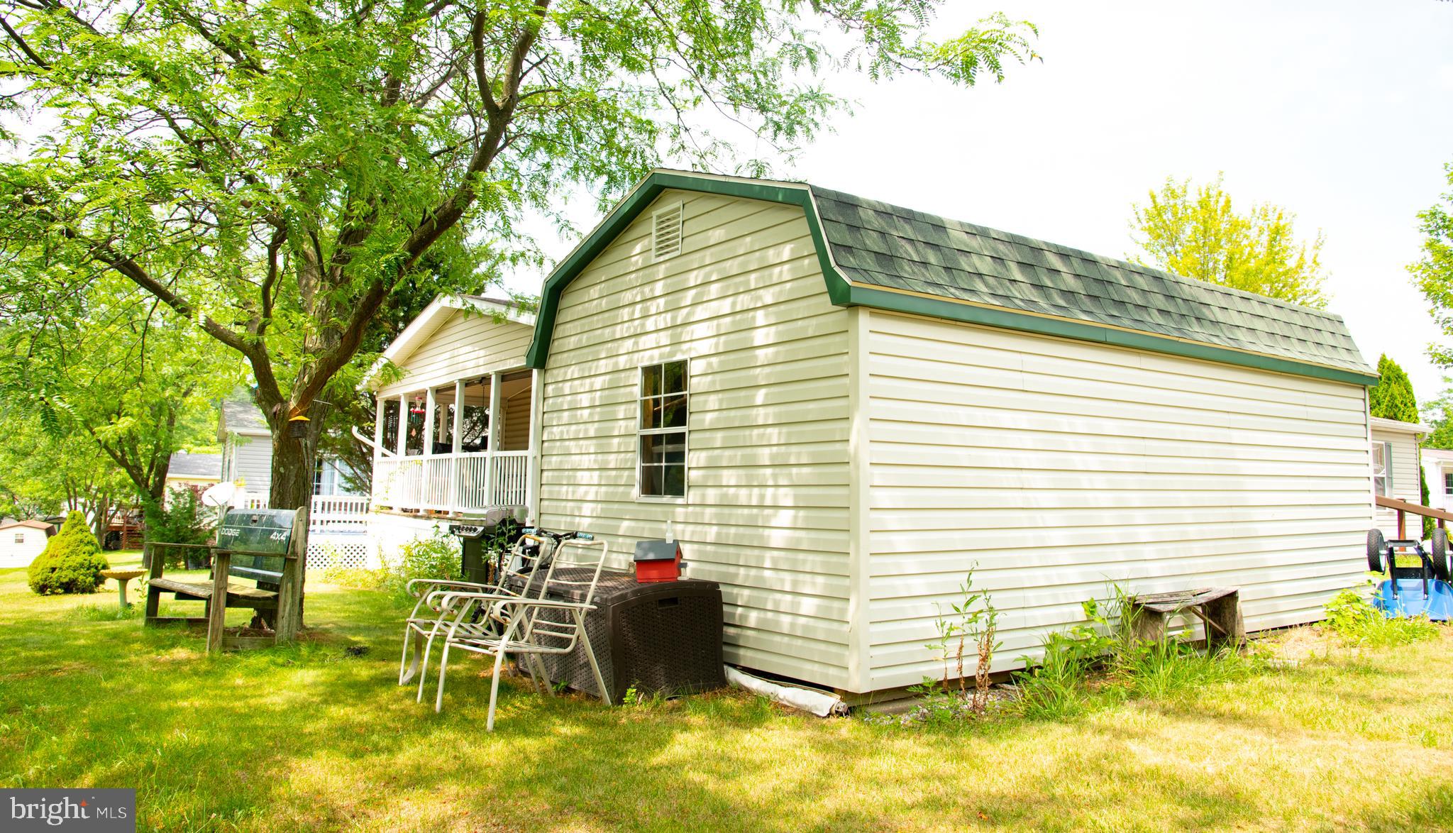104 Raptor Drive Hanover, PA 17331 - Photo 5 of 30 a backyard of a house with table and chairs